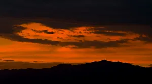 Clouds are lit up by a sunset over the Sheep Mountain Range north of Las Vegas Clouds are lit up by a sunset over the Sheep Mountain Range north of Las Vegas