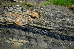 A coal seam can be seen in the rock along the highway in Partridge A coal seam can be seen in the rock along the highway in Partridge