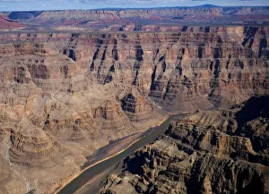 The Colorado River runs through the west rim of the Grand Canyon in Arizona The Colorado River runs through the west rim of the Grand Canyon in Arizona
