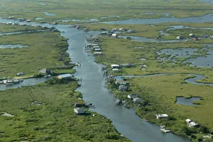 Communities are seen surrounded by water and wetlands in Plaquemines Parish, Louisiana Communities are seen surrounded by water and wetlands in Plaquemines Parish, Louisiana