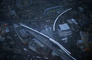 Commuter trains are seen at dusk in an aerial photograph from The View gallery at the Shard Commuter trains are seen at dusk in an aerial photograph from The View gallery at the Shard