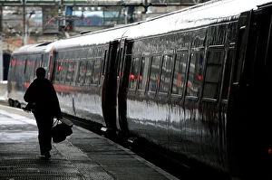 Images Dated 2nd January 2006: Commuter walks to board a train at Kings Cross station in central London