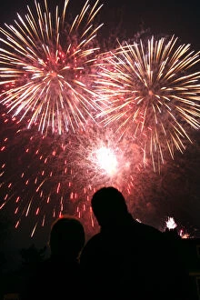 Images Dated 21st April 2006: A couple watches fireworks explode over Kew Gardens in London