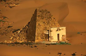 Creeping desert sands surround the Royal Cemeteries of Meroe Pyramids in Begrawiya at Creeping desert sands surround the Royal Cemeteries of Meroe Pyramids in Begrawiya at