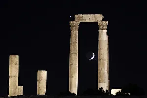 The crescent moon and planet Venus appear behind Roman pillars of the Temple of Hercules The crescent moon and planet Venus appear behind Roman pillars of the Temple of Hercules