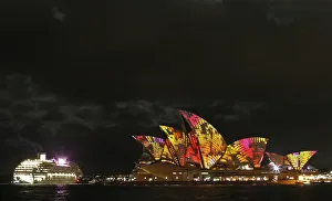 A cruise ship navigates past the Sydney Opera House as Play by The Spinifex Group A cruise ship navigates past the Sydney Opera House as Play by The Spinifex Group