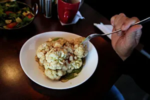Juarez Gallery: A customer eats a vegetarian dish at Tasty Beet Juicy and Healthy Food restaurant in
