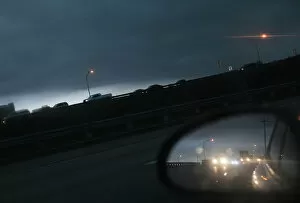 Dark clouds pass over a highway near downtown Miami, Florida