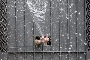 Images Dated 24th August 2011: A demonstrator gestures from Chile University central building during a 48-hour national