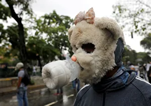 A demonstrator wears a homemade gas mask while rallying against Venezuelas President A demonstrator wears a homemade gas mask while rallying against Venezuelas President