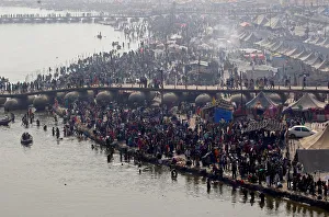Devotees take a holy dip at Sangam, the confluence of the Ganges Devotees take a holy dip at Sangam, the confluence of the Ganges