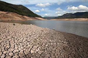 Dried mud is seen during a low-level period of water in Concepcion reservoir on the Dried mud is seen during a low-level period of water in Concepcion reservoir on the