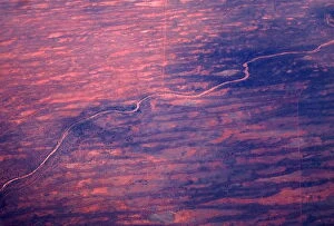 Images Dated 11th February 2016: A dried-up river can be seen next to sand dunes and salt pans in outback Australia