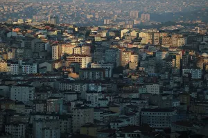 Early morning sunlight cuts across residential housing that stretches to the horizon of Early morning sunlight cuts across residential housing that stretches to the horizon of