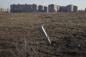 Emptied cluster munitions container is seen stuck in the ground outside apartment blocks Emptied cluster munitions container is seen stuck in the ground outside apartment blocks