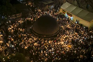 Ethiopian Orthodox worshippers hold candles during the Holy Fire ceremony in Jerusalem's Ethiopian Orthodox worshippers hold candles during the Holy Fire ceremony in Jerusalem's