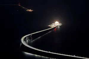 A evening view of the Hong Kong-Zhuhai-Macau bridge off Lantau island in Hong Kong A evening view of the Hong Kong-Zhuhai-Macau bridge off Lantau island in Hong Kong