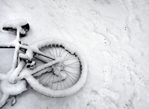Images Dated 2nd February 2009: A fallen bicycle lies in the snow in Cambridge in eastern England