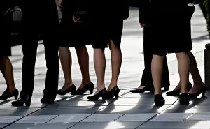 Commuter Gallery: Female office workers wearing high heels, clothes and bags of the same colour are seen at