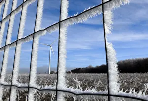 Fences and fields are covered with frost near the A6 highway also known as the Autoroute Fences and fields are covered with frost near the A6 highway also known as the Autoroute