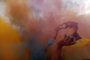 Festival goers throw powder at a colour party during Budapests Sziget music festival Festival goers throw powder at a colour party during Budapests Sziget music festival
