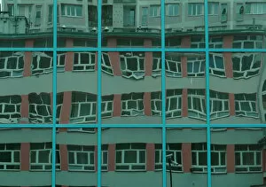 Abstracts Gallery: FILE PHOTO: Block of flats is reflected in the windows of an office building in Warsaw
