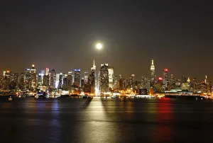 File photo of a full moon rising over the New York skyline above 42nd Street, seen File photo of a full moon rising over the New York skyline above 42nd Street, seen