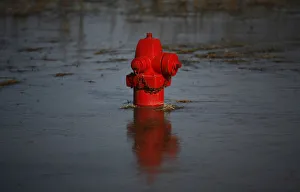 A fire hydrant in floodwaters that froze overnight is seen near a levee in Valley City A fire hydrant in floodwaters that froze overnight is seen near a levee in Valley City