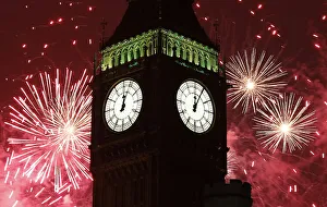 Fireworks explode behind The Big Ben clock tower during New Year celebrations in London Fireworks explode behind The Big Ben clock tower during New Year celebrations in London