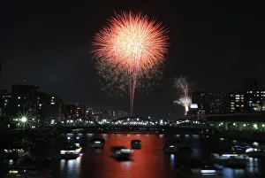 Fireworks explode over high-rise buildings and Tokyos Sumida river during the Sumida Fireworks explode over high-rise buildings and Tokyos Sumida river during the Sumida