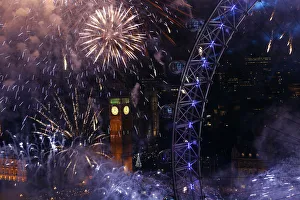 Fireworks explode beside the London Eye and The Houses of Parliament on the River Fireworks explode beside the London Eye and The Houses of Parliament on the River