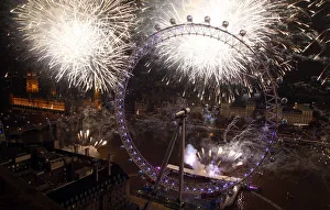 Fireworks explode beside the London Eye and The Houses of Parliament on the River Fireworks explode beside the London Eye and The Houses of Parliament on the River
