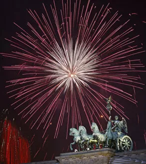 Images Dated 1st January 2010: Fireworks explode above the Quadriga atop the Brandenburg Gate during New Year celebrations