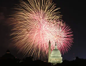 Fireworks explode over the United States Capitol dome and Washington Monument Fireworks explode over the United States Capitol dome and Washington Monument