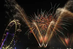 Fireworks explode beside Viennas Giant Ferris Wheel at Prater park during New Year Fireworks explode beside Viennas Giant Ferris Wheel at Prater park during New Year