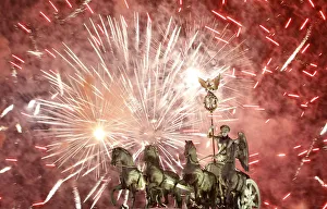 Fireworks illuminate Quadriga sculpture atop Brandenburg Gate in Berlin Fireworks illuminate Quadriga sculpture atop Brandenburg Gate in Berlin
