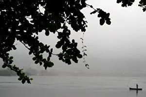Fisherman is seen during a rainy day at the Rodrigo de Freitas lagoon in Rio de Janeiro Fisherman is seen during a rainy day at the Rodrigo de Freitas lagoon in Rio de Janeiro