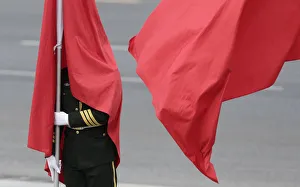 Flag is seen covering the face of a honor guard during a welcoming ceremony for the Flag is seen covering the face of a honor guard during a welcoming ceremony for the