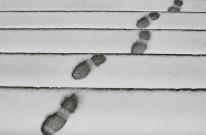 Footprints can be seen on the snow outside Madrids Almudena Cathedral as freezing Footprints can be seen on the snow outside Madrids Almudena Cathedral as freezing