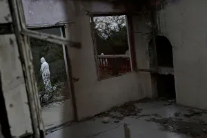 Forensic technicians work at a site believed to be a mass grave at an abandoned ranch in Forensic technicians work at a site believed to be a mass grave at an abandoned ranch in