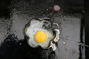 A fried egg is seen on a grill in a roadside snack cafe along the A49 near Tittensor A fried egg is seen on a grill in a roadside snack cafe along the A49 near Tittensor