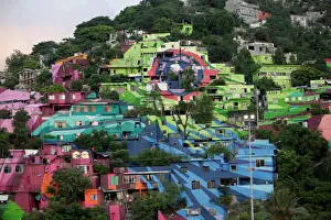 A general view shows colorful painted houses on the side of a hill in neighbourhood Cerro A general view shows colorful painted houses on the side of a hill in neighbourhood Cerro