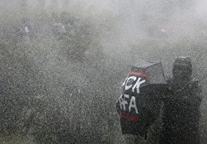 German police use water cannons against right-wing protestors during a demonstration in German police use water cannons against right-wing protestors during a demonstration in