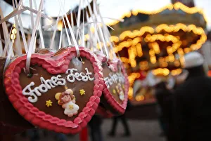 Gingerbread hearts reading Merry Christmas are on display at a booth at the opening Gingerbread hearts reading Merry Christmas are on display at a booth at the opening