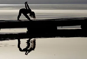 New Gallery: A girl practices yoga on the banks of Lake Ohrid in Ohrid