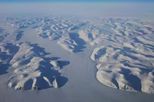 Glaciers wind their way through mountains on the way to the coast above eastern Greenland Glaciers wind their way through mountains on the way to the coast above eastern Greenland