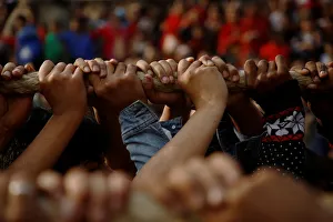 Hands of devotees are pictured as they pull the chariot of God Bhairab during the Biska Hands of devotees are pictured as they pull the chariot of God Bhairab during the Biska