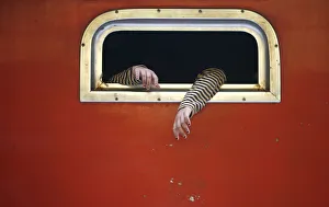 The hands of a passenger on board a train are pictured at the train station in Jakarta The hands of a passenger on board a train are pictured at the train station in Jakarta