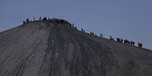 Hindu devotees climb towards the crater of the Chandargup mud volcano in Pakistan's Hindu devotees climb towards the crater of the Chandargup mud volcano in Pakistan's