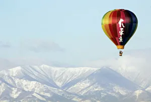 A hot air balloon flies over Obihiro, northern Japan A hot air balloon flies over Obihiro, northern Japan